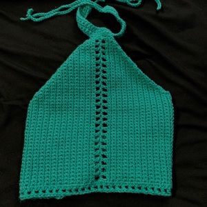 A teal crotchet crop top